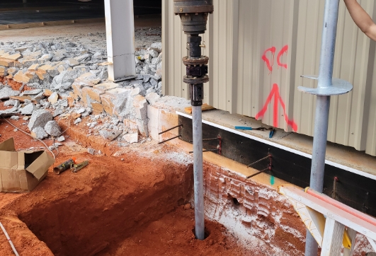 Helical Piers installation at a commercial property in the Gulf Coast region