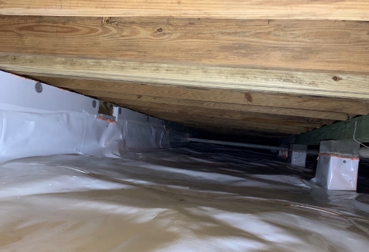 Floor joists in an encapsulated crawl space under a coastal home