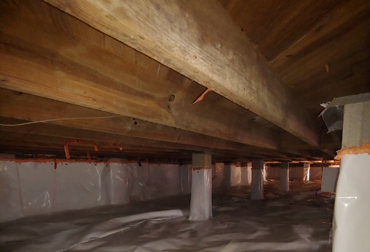 Floor joists supporting a crawl space floor after a floor joist repair by MDH Foundation Repair
