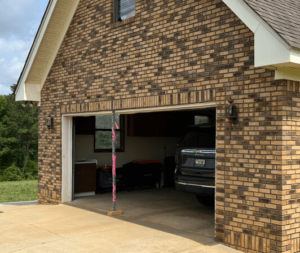 Structural support beam and galvanized lintel installed during garage lintel repair